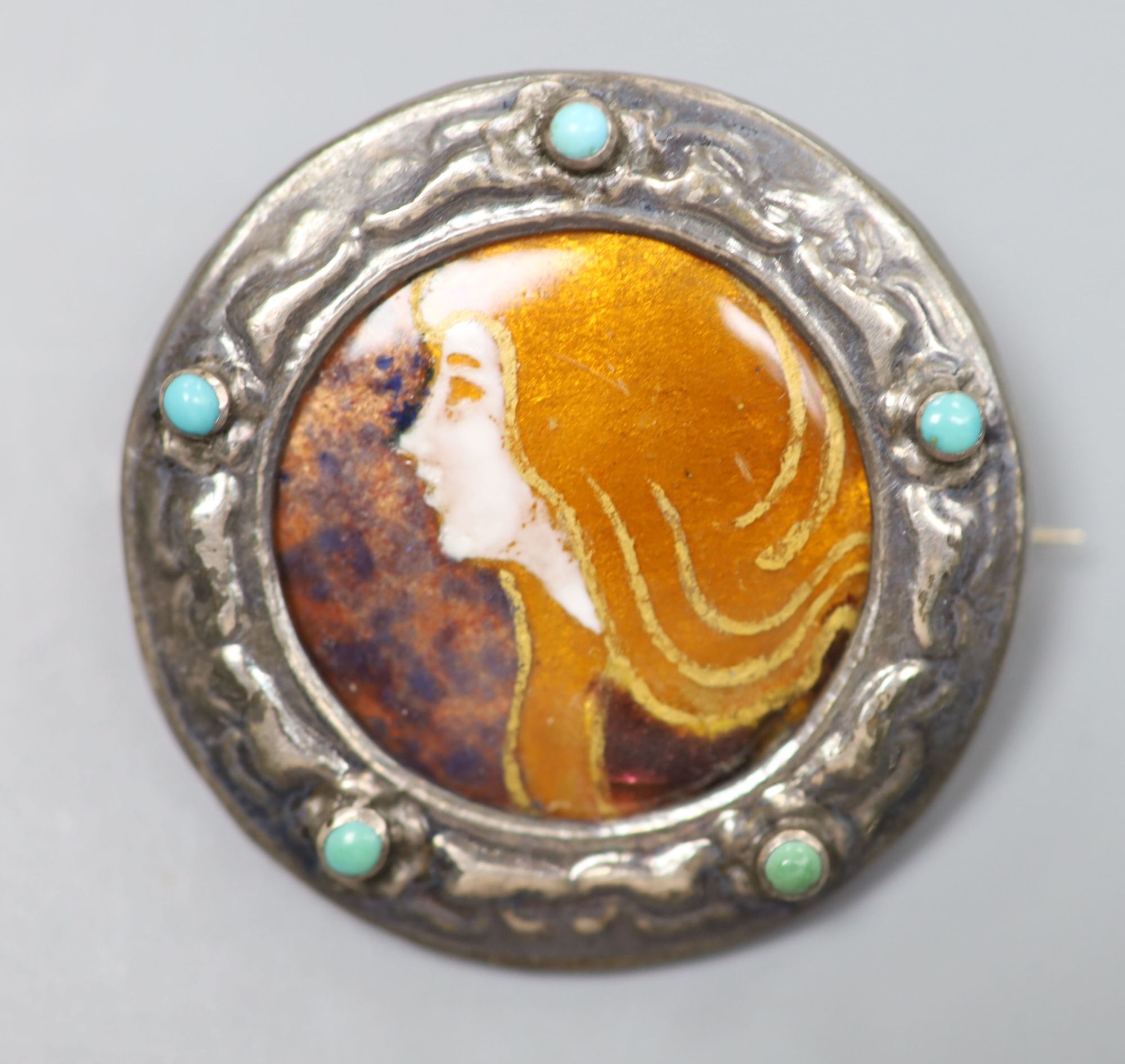 An early 20th century French white metal and turquoise mounted Limoges? enamel circular brooch, 39mm, gross 10 grams.